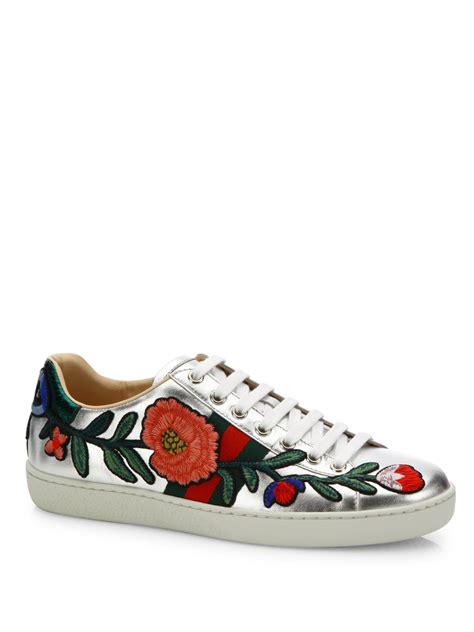 gucci floral embroidered sneakers.